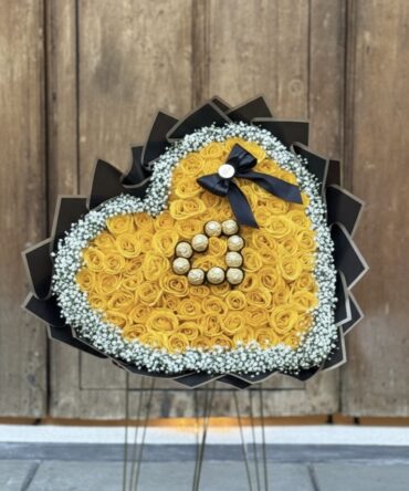 Corazón de rosas amarillo con Ferrero